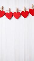 AI generated Red hearts on rope with clothespins on a white wooden Valentine copy space background photo