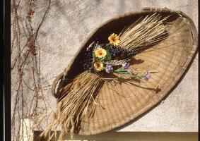 a basket with flowers and leaves photo