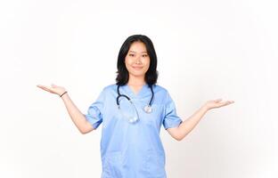 Young Asian female doctor showing copy space on two open palm isolated on white background photo