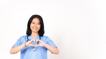 Young Asian female doctor showing love sign isolated on white background photo