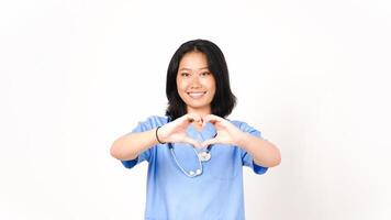 Young Asian female doctor showing love sign isolated on white background photo