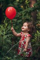 ai generado pequeño floración niñito elegancia en un rojo floral primavera vestir foto