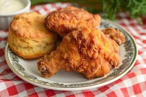 AI generated Southern Comfort Crispy Fried Chicken and Buttery Biscuits photo