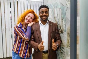 Portrait of young couple who owns small business bath store. Man and woman work in partnership. photo