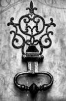 black and white photograph of a door handle photo
