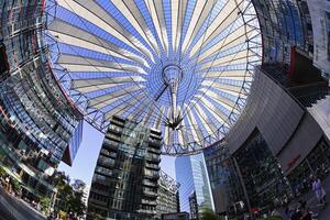 Berlin, Germany, 2021 - Tented glass roof dome with skyscrapers of the Sony Center, Potsdam Square, Berlin, Germany photo