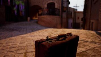 A suitcase sitting on a cobblestone street video