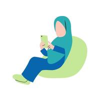 hijab mujer jugando tableta en sofá vector