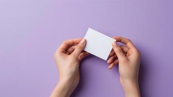 AI generated cropped view of woman holding blank business card on lilac background photo