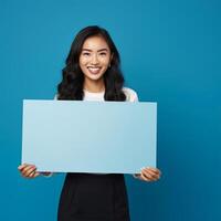 AI generated businesswoman holding blank board, isolated on blue background photo