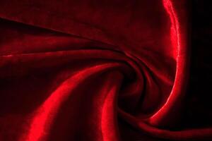 Abstract background made of red velvet fabric. photo