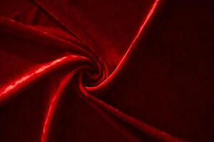 Abstract background made of red velvet fabric. photo