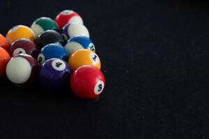 Close up View of Man Playing Pool Table photo