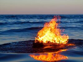 AI generated burning fire in the sea photo