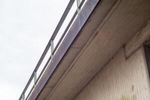 concrete bridge with railing from below photo