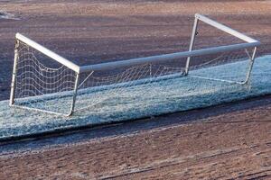 overturned soccer goal in the stadium photo