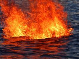 AI generated burning fire in the sea photo