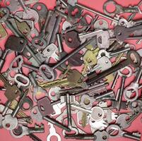 Keys set on pink background. Door lock keys and safes for proper photo