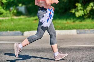 Running woman on road photo