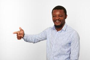 Happy african american black man with pointing finger in casual bright shirt isolated background photo