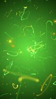 Vertical video - party and celebration motion background animation with dancing, glowing green and gold particles of light and streamers. Full HD, looping Saint Patrick's Day party background.