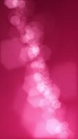 Vertical video - defocused bokeh lights background. This elegant magenta motion background animation with hexagonal lens blur bokeh particles is full HD and a seamless loop.