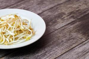 Mung bean sprouts in plate. Raw organic healthy food. Traditional vegetable dish in east Asia. photo