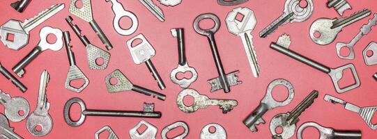 Keys set on pink background. Door lock keys and safes for proper photo