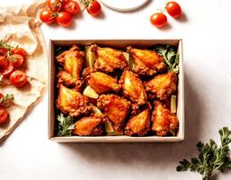 top view, chicken wings in a box on a white background photo