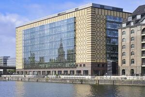 Berlin, Germany, 2021 - Reflection on a glass window building, Spree river, Berlin, Germany photo