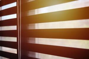 Office blinds. Sunlight through modern fabric blinds. Office meeting room lighting range control. photo