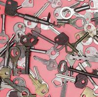 Keys set on pink background. Door lock keys and safes for proper photo