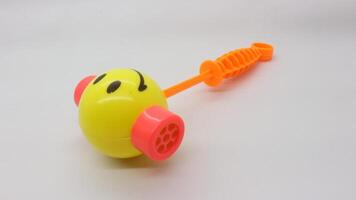 Yellow toy hammer isolated photo