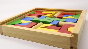 Colorful wooden puzzle toys are neatly arranged photo