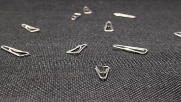 Close up of paper clips scattered photo