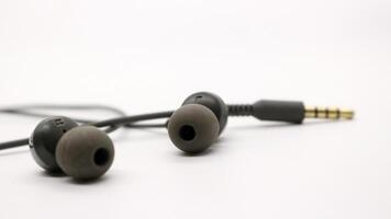 Close up of black wired earphones photo