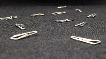 Close up of paper clips scattered photo