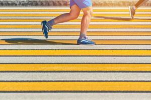 Man running crosswalk, copy space photo