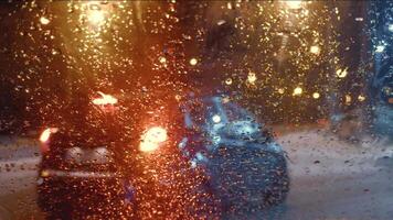 View of road through windshield of car during difficult weather conditions with precipitation. video