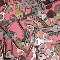 Keys set on pink background. Door lock keys and safes for proper photo