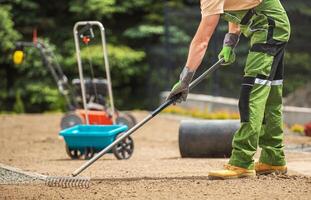 Landscaper Preparing Backyard Soil for a Grass Seeding photo