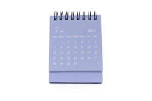 Simple blue desk calendar for July 2024 isolated on white background. Calendar concept with copy space photo