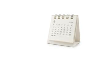 Simple desk calendar for April 2024 isolated on white background. Calendar concept with copy space. Clipping path. photo