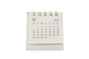 Simple desk calendar for October 2024 isolated on white background. Calendar concept with copy space. Clipping Path. photo