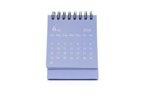 Simple blue desk calendar for JUNE 2024 isolated on white background. Calendar concept with copy space. photo