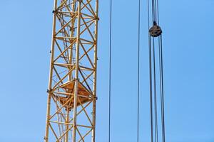 Construction crane working on building complex photo