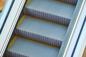 Modern escalators in shopping center photo