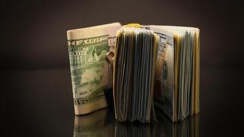 stack of dollar bills collected in an elastic band and a stationery clip video