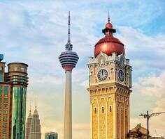 Kuala Lumpur, Malaysia on May 22, 2023. Close up of the clock tower, Big Ben Malaysia. Seen the Kuala Lumpur Tower. Near Masjid Jamek station. photo