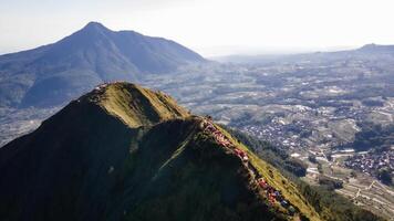 Aerial view of the peak of Mount Andong in Magelang in the morning. You can see climbers camping between the mountain slopes photo